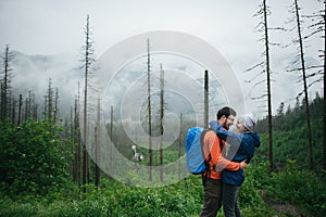 Traveler couple in love enjoying the mountains