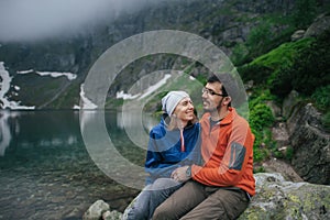 Traveler couple in love enjoying the mountains