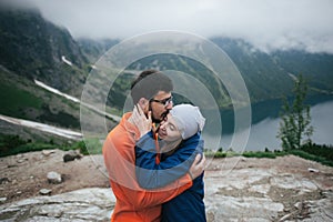 Traveler couple in love enjoying the mountains