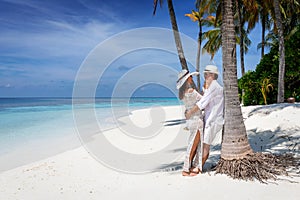 Traveler couple in love on a tropical beach