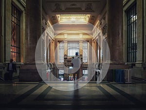 Traveler descending the stairs of a station