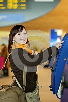 Traveler doing self-checkin in the airport