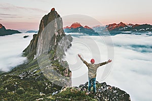 Traveler enjoying sunset Segla mountain hiking adventure