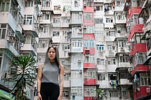 Traveler Exploring Densely Populated Housing Apartments in Hong Kong photo