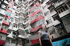 Traveler Exploring Densely Populated Housing Apartments in Hong Kong photo