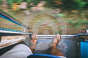 Traveler feet on the train tambour during the train move