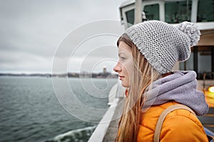Traveler girl looking at the sea