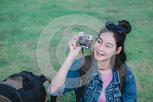 Traveler girl`s sitting take a photo and smile looking the natur