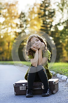 Traveler girl with a suitcase