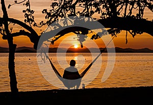 Traveler in Hammock Watching Sunrise