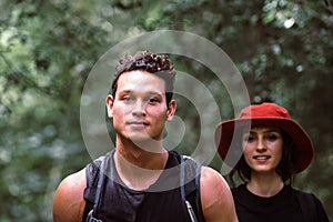 Traveler handsome man walking and looking to something at rain forest,Enjoying backpacking concept