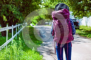 Traveler Holding Hicking Bag On The Road