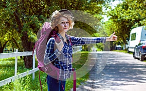 Traveler Holding Hicking Bag On The Road