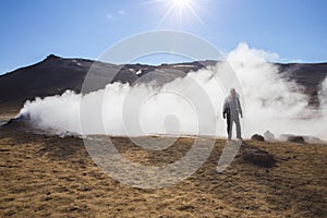 Traveler at Hverarondor Hverir hot springs, Iceland