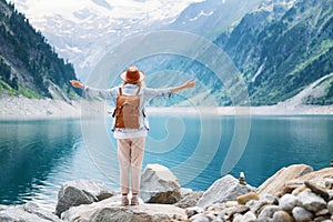 Traveler-Image. Traveler look at the mountain lake. Travel and active life concept.