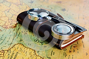 Traveler items on map background with copy space, close-up