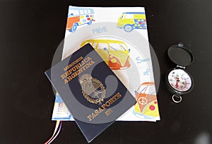 traveler items: travel journal, compass and passport photo