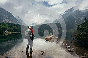 Traveler at Lake Popradske Pleso in High Tatras