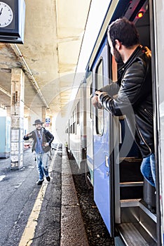 Traveler is late for the train and running to catch it in time!