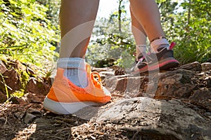 Traveler legs, two women walking on path