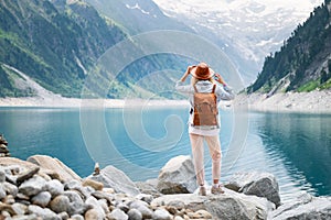 Traveler look at the mountain lake. Travel and active life concept. Adventure and travel