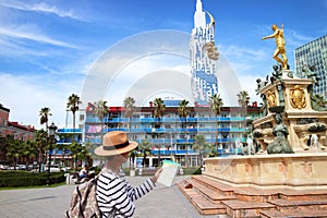 Traveler Looking at the Map in front of Neptune Fountain on Theater Square in Batumi, Georgia