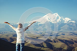 Traveler looking to Elbrus mountain