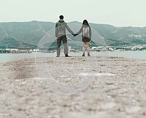 Traveler loving couple standing on pier
