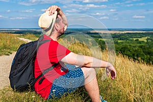 Traveler male relaxing meditation with serene view mountains landscape summer day.Relaxing middle age man.closeup