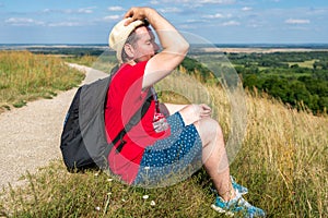 Traveler male relaxing meditation with serene view mountains landscape summer day.Relaxing middle age man.closeup