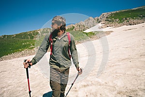 Traveler Man with backpack mountaineering glacier