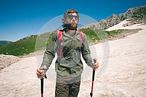 Traveler Man with backpack mountaineering glacier