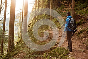 Traveler Man with backpack mountaineering Travel Lifestyle concept mountains on background Summer trip vacations outdoor