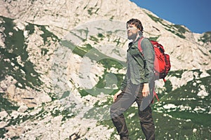 Traveler Man bearded with backpack mountaineering