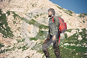 Traveler Man bearded with backpack mountaineering