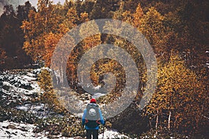 Traveler Man hiking alone autumn forest