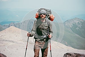 Traveler Man hiking in mountains with backpack Travel