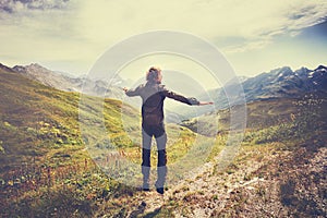 Traveler Man jumping with mountains landscape on background