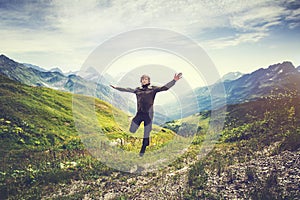 Traveler Man jumping with mountains landscape on background