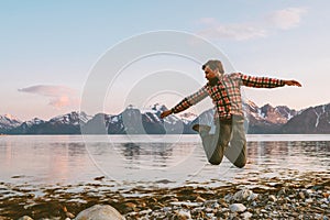Traveler man jumping outdoor travel active healthy lifestyle