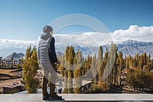 Traveler Man standing and looking view of landscape in Leh Ladakh District ,Norther part of India