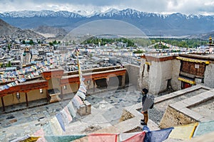Traveler Man standing and looking view of landscape in Leh Palace ,Norther part of India
