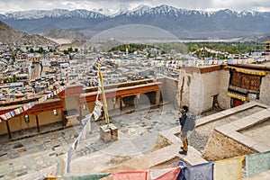 Traveler Man standing and looking view of landscape in Leh Palace ,Norther part of India photo