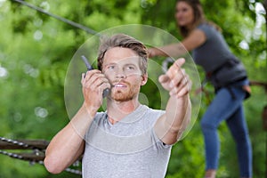 Traveler man using walkie talkie outdoors