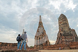 Traveler man and women with backpack walking in asia temple Ayuttaya, photo