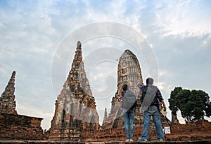Traveler man and women with backpack walking in temple Ayuttaya