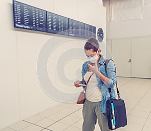 Traveler with mask stuck in airport no able to return home country due to COVID-19 border closures