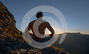 Traveler meditate on mountain
