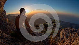 Traveler meditate on mountain