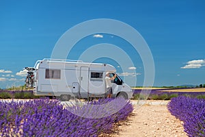 Traveler with mobile home at lavender fields in France